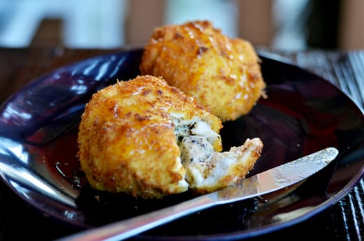 deep fried bread served with honey sauce , ice cream inside