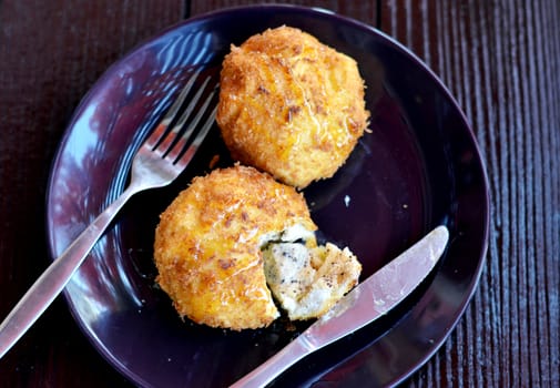 deep fried bread served with honey sauce , ice cream inside