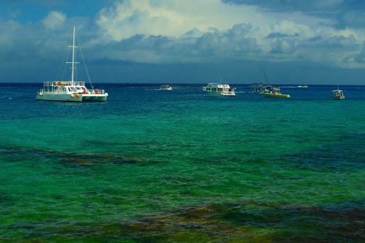 white boats on the aqua caribbean water