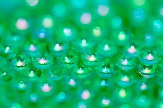 Green beads on the mirror with shallow DOF in landscape  orientation