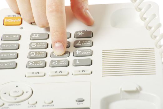 finger with  white telephone keypad