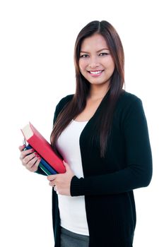 Portrait of a beautiful young Asian woman carrying books over white background