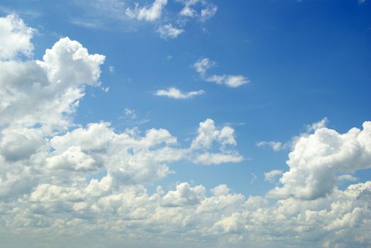 Blue sky background with a tiny clouds