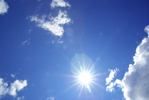 Blue sky background with a tiny clouds