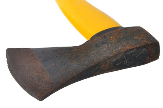 Macro closeup of old rusty ax head with yellow handle isolated on white background