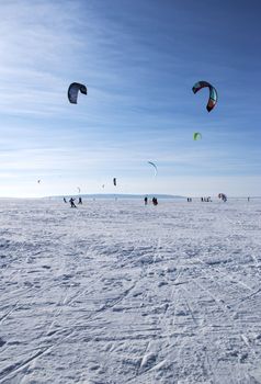 Winter kite skiing on the frozen river