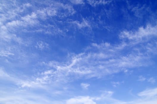 blue sky background with tiny clouds