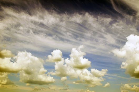 Blue sky background with tiny clouds