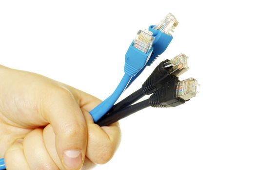 Computer cables in hand isolated on white background