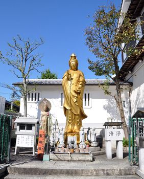 Golden Statue of Guan Yin(goddess of mercy) in Japanese Temple 