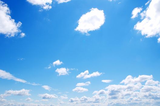 blue sky background with tiny clouds