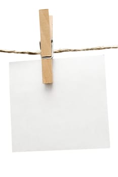 Blank note hanging on a clothesline. Isolated on a white background.