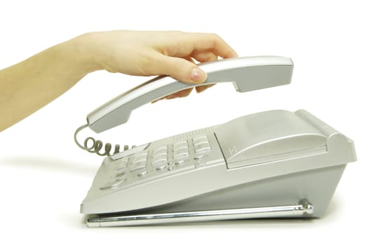 telephone receiver in hand isolated on white
