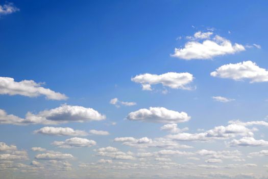 blue sky background with tiny clouds