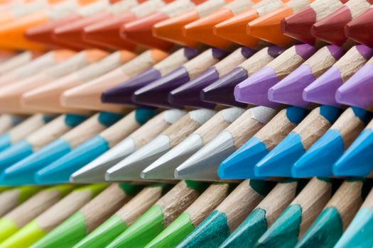 Abstract shot of stacked colored pencils. Shallow depth of field.