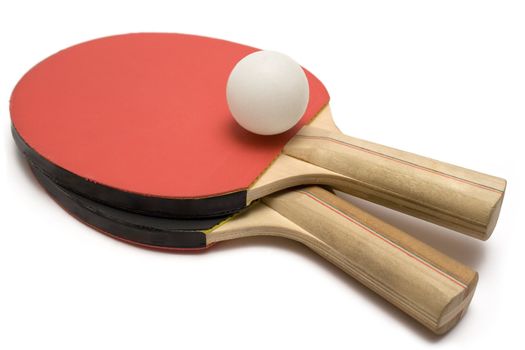 Two ping pong paddles with ball isolated on a white background.