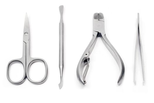 Various manicure tools isolated on white.