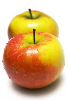 Two wet apples isolated on a white background.