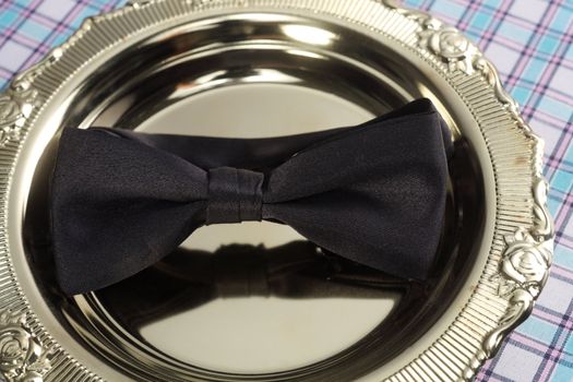 bowtie rest on the golden tray