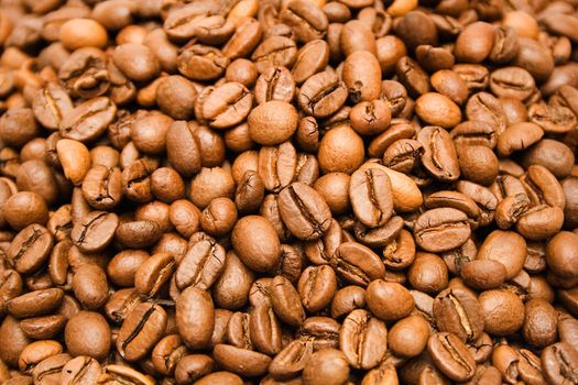 Heap of brown coffee beans.