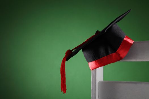 mortar board on the chair