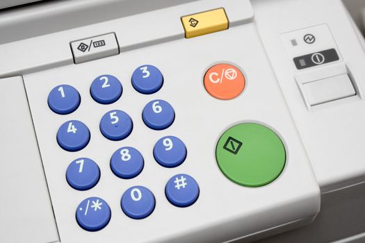 Close-up on a control panel of an office copier.