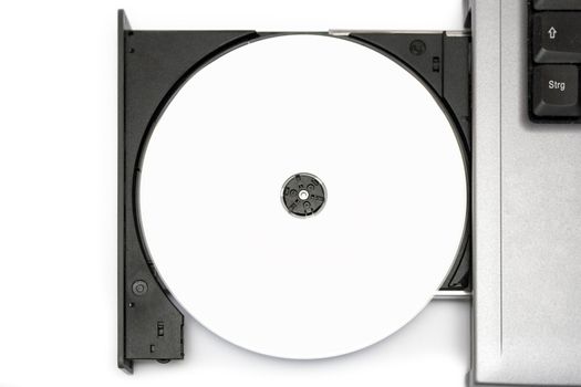 Top view on a blank CD in a notebook drive. White background.