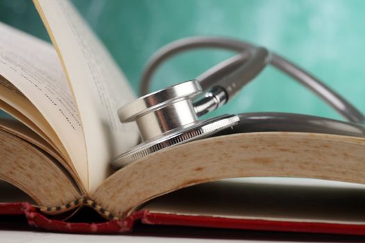 stethoscope resting on the book