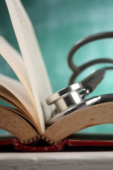 stethoscope resting on the book