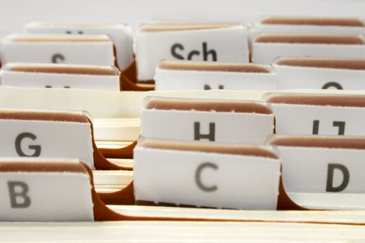 Files with letter tabs for keeping addresses and phone numbers.