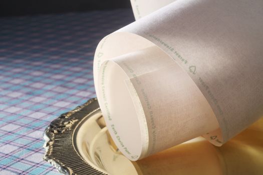 paper roll with printout on the tray