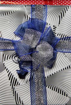 Beautiful present box with silver and blue ribbon