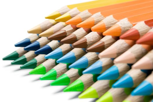 Stack of colorful pencils isolated on a white background.