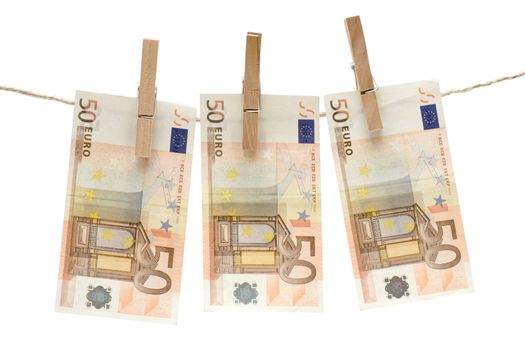 Three fifty euro bills hanging on a clothesline. Isolated on a white background.