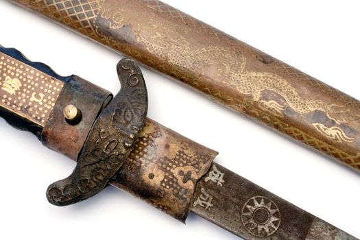 Detail shot of an ancient sword. Isolated on a white background.