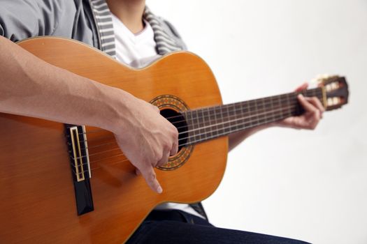 crop image of the man holding a guitar