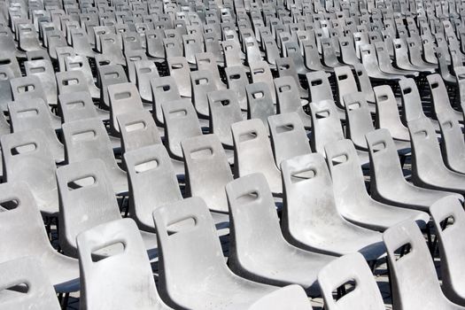 Rows of empty grey plastic seats.