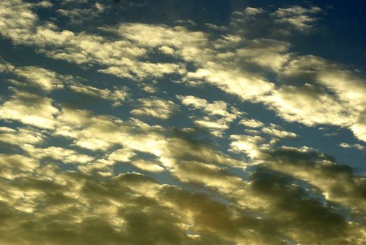 Blue sky background with tiny clouds