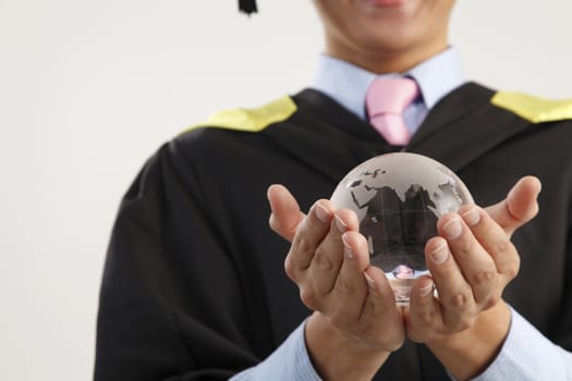 mid section of the man holding glass globe