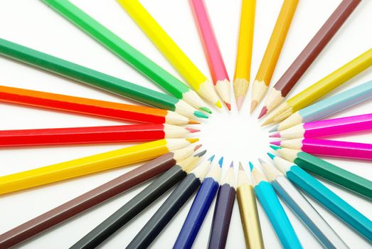  Assortment of coloured pencils  on white background
