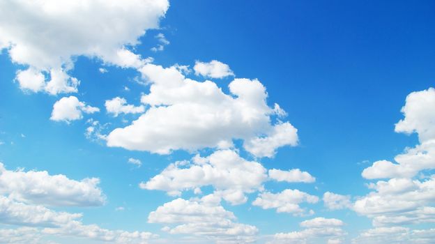 Blue sky background with tiny clouds