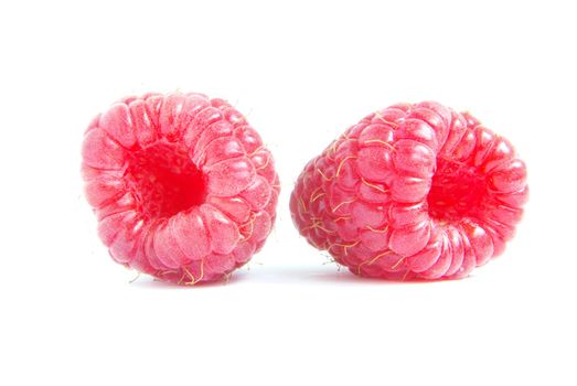 Ripe raspberry on a white background