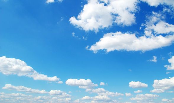 blue sky background with tiny clouds