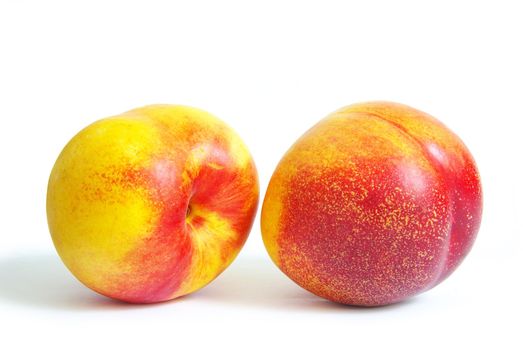 Ripe peach fruits isolated on white background