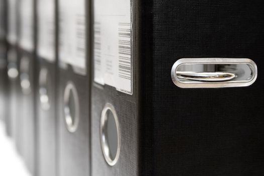 Black ring binders side by side.