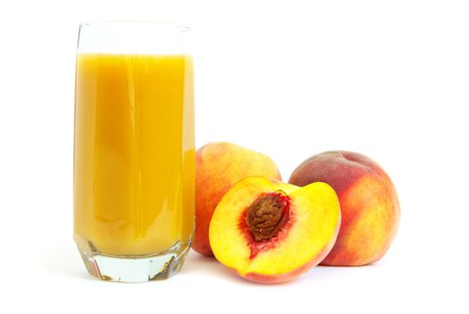 Glass with freshly made peach juice on a white background