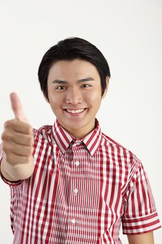 man showing thumbs up sign with smiling