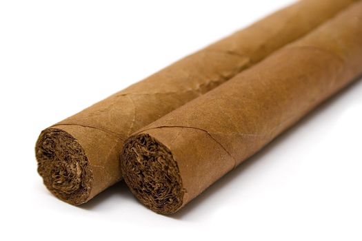 Close-up on two brown cigars isolated on a white background.