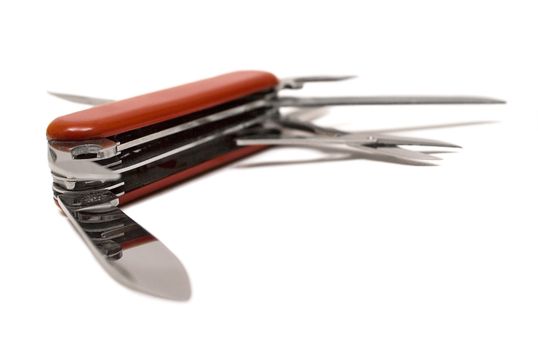 Open multitool penknife isolated on a white background.