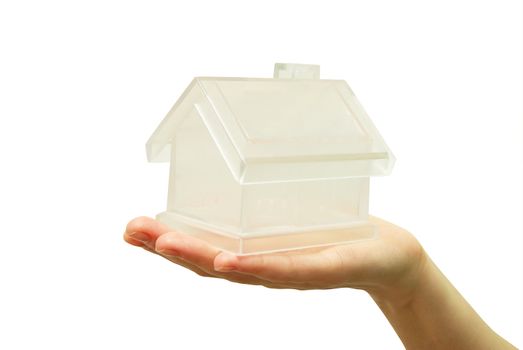 The house in human hand on white